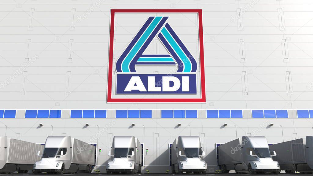 Trailer trucks at warehouse loading bay with logo on the wall. Editorial 3D