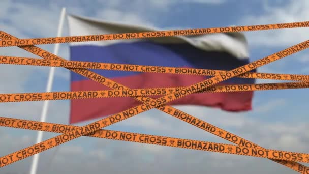 Cuidado com fita de risco biológico com bandeira da Rússia como pano de fundo. Entrada restrita russa ou quarentena. Conceptual looping animação 3D — Vídeo de Stock