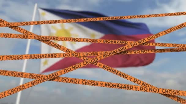 Försiktighet biologiskt riskband med Filippinernas flagga som bakgrund. Begränsad inresa eller karantän. Konceptuell looping 3D-animering — Stockvideo