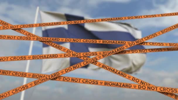 Biohazard restriction tape lines against the Finnish flag. Restricted entry or quarantine in Finland. Conceptual looping 3D animation — Stock Video