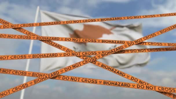 Biohazard restriction tape lines against the Cypriot flag. Restricted entry or quarantine in Cyprus. Conceptual looping 3D animation — Stock Video