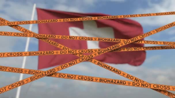 Plakband voor biologische risico 's tegen de Zwitserse vlag. Beperkte grensoverschrijding of quarantaine in Zwitserland. Conceptuele looping 3d animatie — Stockvideo