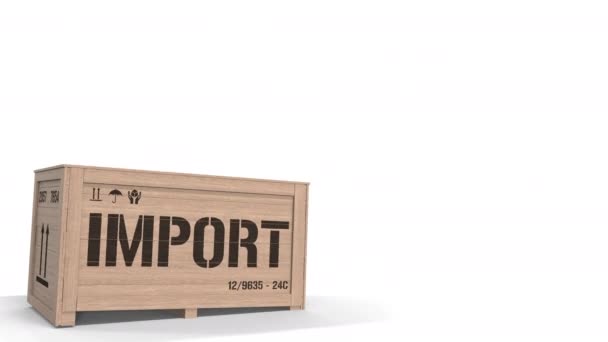 Wooden crate with printed IMPORT text on white background. 3D animation — Stock Video