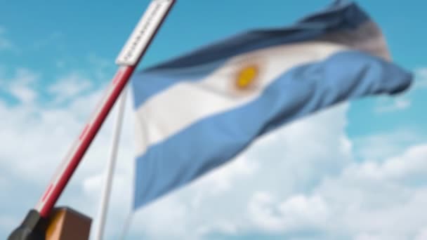 Closed boom gate with QUARANTINE sign on the Argentinean flag background. Border closure or infection related isolation in Argentina — Stock Video