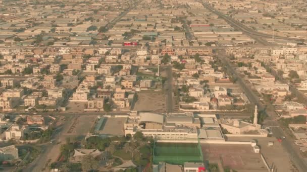 Aerial view of a school with sports facilities within residential area in Dubai, UAE — Stock Video