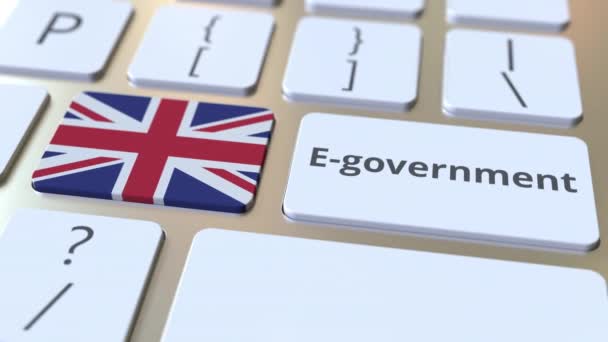 E-government ή Electronic Government κείμενο και σημαία του ΗΒ στο πληκτρολόγιο. Σύγχρονες δημόσιες υπηρεσίες σχετικές εννοιολογικές 3d κινούμενα σχέδια — Αρχείο Βίντεο