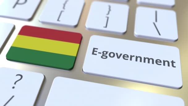 E-government або Electronic Government текст і прапор Болівії на клавішних. Сучасні публічні послуги пов'язують концептуальну 3D анімацію — стокове відео