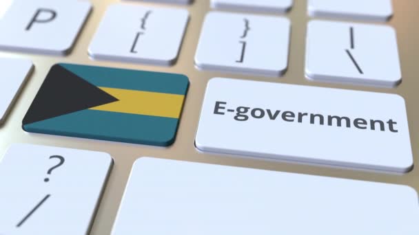 Texto de gobierno electrónico o Gobierno electrónico y bandera de las Bahamas en el teclado. Animación 3D conceptual relacionada con los servicios públicos modernos — Vídeos de Stock