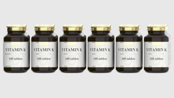 Glasflaschen mit generischen Vitamin-K-Tabletten und fiktionalem Logo. Pharmazeutische industrielle Produktion im Zusammenhang mit 3D-Rendering — Stockfoto