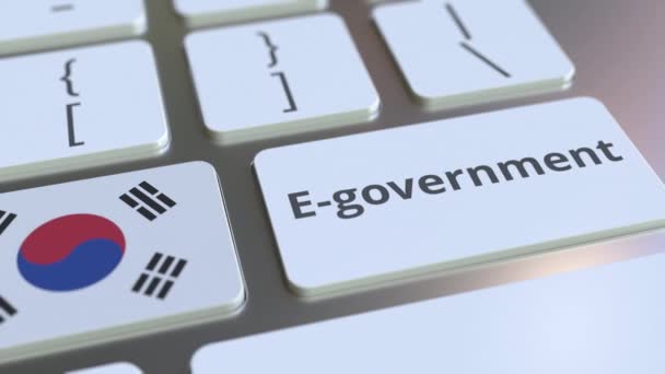 E-government ή Electronic Government κείμενο και σημαία της Νότιας Κορέας στο πληκτρολόγιο. Σύγχρονες δημόσιες υπηρεσίες σχετικές εννοιολογικές 3d κινούμενα σχέδια — Αρχείο Βίντεο