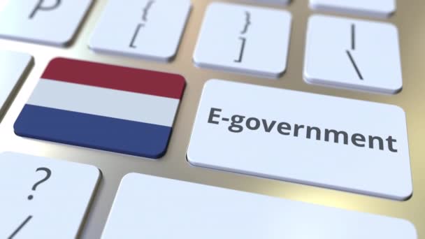 E-government ή Electronic Government κείμενο και σημαία των Κάτω Χωρών στο πληκτρολόγιο. Σύγχρονες δημόσιες υπηρεσίες σχετικές εννοιολογικές 3d κινούμενα σχέδια — Αρχείο Βίντεο