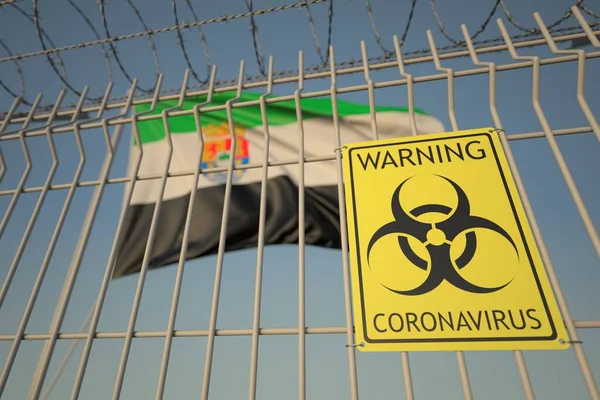 Señal de advertencia de Coronavirus en la valla de alambre de púas cerca de la bandera de Extremadura, una comunidad autónoma en España. COVID-19 renderizado 3D relacionado con cuarentena — Foto de Stock