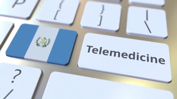 Texto de telemedicina y bandera de Guatemala en el teclado de la computadora. Servicios médicos remotos relacionados con la animación conceptual 3D — Vídeo de stock