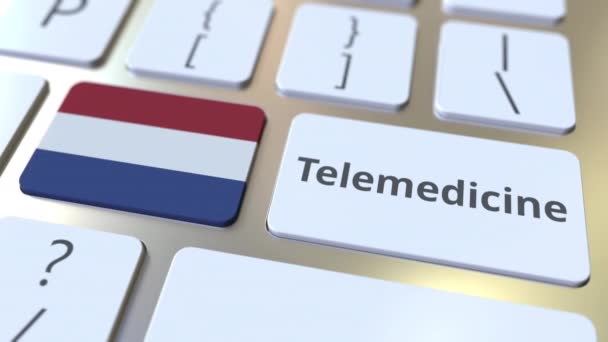 Texto de telemedicina y bandera de los Países Bajos en el teclado de la computadora. Servicios médicos remotos relacionados con la animación conceptual 3D — Vídeo de stock