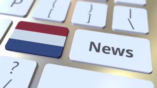Tekst wiadomości i flaga Holandii na klawiszach klawiatury komputera. Krajowe media online związane z konceptualną animacją 3D — Wideo stockowe