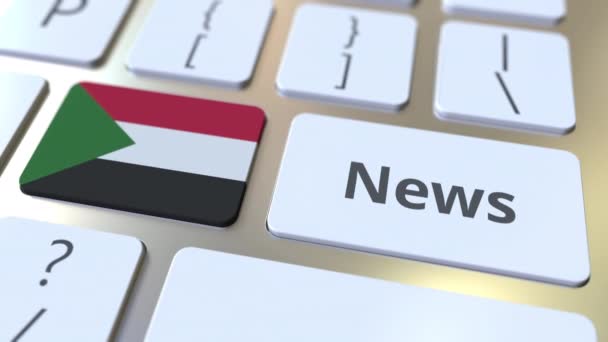 News text and flag of Sudan on the keys of a computer keyboard. National online media related conceptual 3D animation — Stock Video