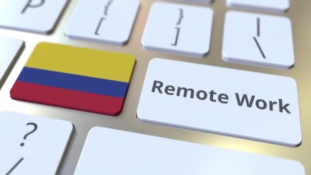 Remote Work text and flag of Colombia on the computer keyboard. Telecommuting or telework related conceptual 3D animation — Stock Video