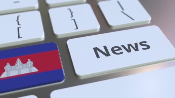 Texto de las noticias y la bandera de Camboya en las teclas de un teclado de ordenador. Animación 3D conceptual relacionada con los medios nacionales en línea — Vídeo de stock