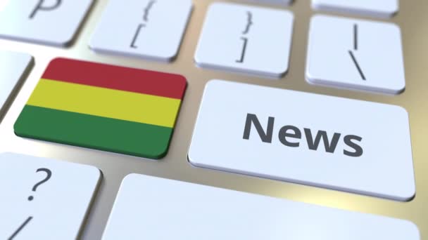 News text and flag of Bolivia on the keys of a computer keyboard. National online media related conceptual 3D animation — Stock Video