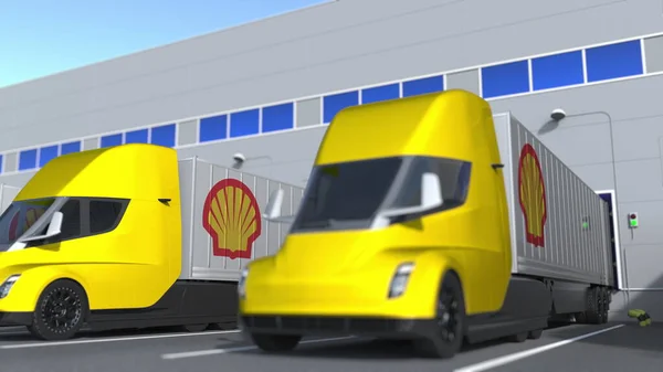 Elektro-Anhänger mit Royal Dutch Shell-Logo werden im Lager be- oder entladen. Logistikbezogenes 3D-Rendering — Stockfoto