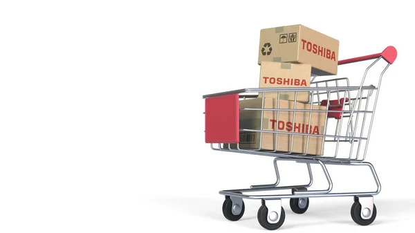 Viele Kartons mit TOSHIBA-Logo im Einkaufswagen. Editorisches 3D-Rendering — Stockfoto