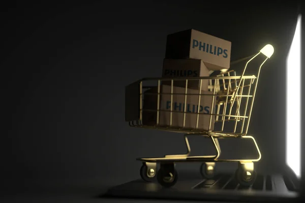 Mnoho kartonů s logem PHILIPS ve zlatém nákupním vozíku na notebooku. Editorial premium service related 3D rendering — Stock fotografie