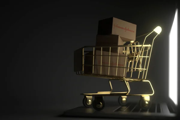Κουτιά με λογότυπο JOHNSON και JOHNSON σε χρυσό καροτσάκι αγορών στο laptop. Editorial premium υπηρεσία 3D απόδοση — Φωτογραφία Αρχείου