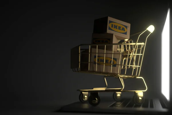Tři kartony s logem IKEA ve zlatém nákupním vozíku na notebooku. Editorial premium service related 3D rendering — Stock fotografie