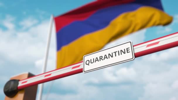 Бар'єрні ворота з написом QUARANTINE відкриті з прапором Вірменії як тло. Кінець вірменського Локдауну — стокове відео