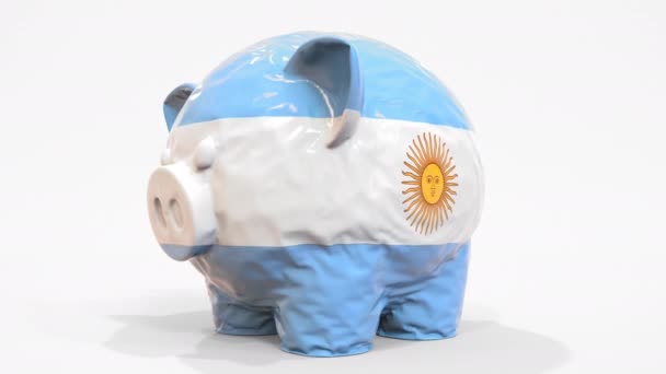 Deflating o banco inflável do porquinho com bandeira impressa de Argentina. Crise financeira argentina relacionada animação 3D conceitual — Vídeo de Stock