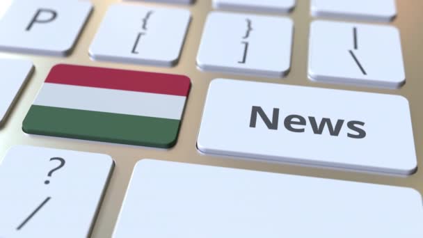 Nieuwsbericht en vlag van Hongarije op de toetsen van een toetsenbord. Nationale online media gerelateerde conceptuele 3D animatie — Stockvideo