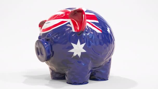 Deflating alcancía inflable con bandera impresa de Australia. Animación 3D conceptual relacionada con la crisis financiera australiana — Vídeo de stock