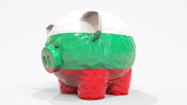 Deflační nafukovací prasátko s tištěnou vlajkou Bulharska. Bulharská finanční krize související konceptuální 3D animace — Stock video