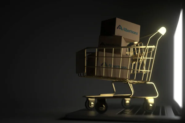 Krabičky s logem ALBERTSONS ve zlatém nákupním košíku na klávesnici počítače. Editorial premium online service related 3D rendering — Stock fotografie