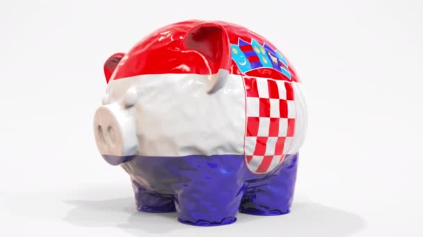 Felfújható malacpersely horvát zászlóval. Horvát pénzügyi válsággal kapcsolatos koncepció 3D animáció — Stock videók