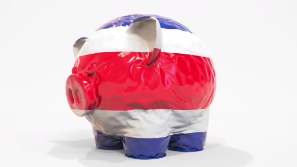 Deflating alcancía inflable con bandera impresa de Costa Rica. Animación conceptual 3D relacionada con la crisis financiera costarricense — Vídeo de stock