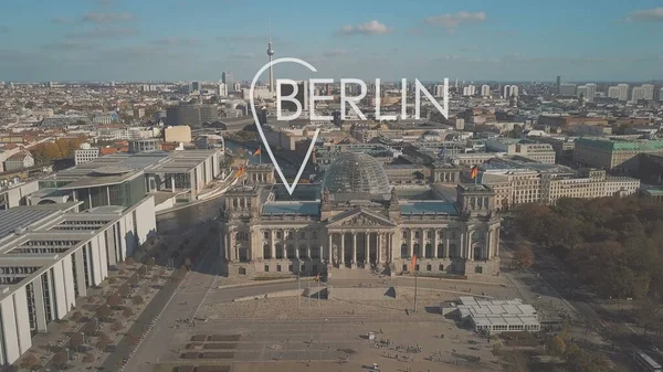 Aerial establishing shot of Berlin involving famous Reichstag building with city geotag, Germany — Stock Photo, Image