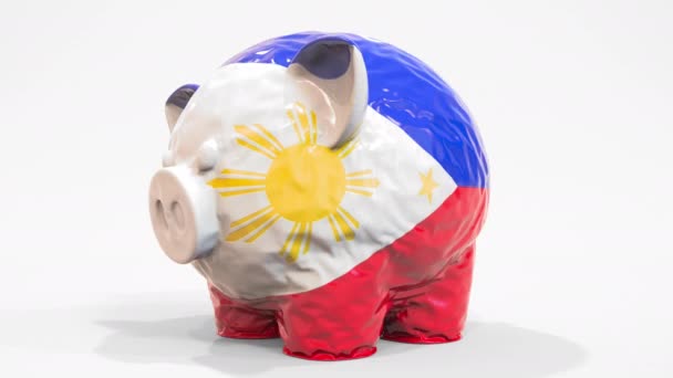 Felfújható malacpersely a Fülöp-szigetek nyomtatott zászlajával. Pénzügyi válsággal kapcsolatos koncepció 3D animáció — Stock videók