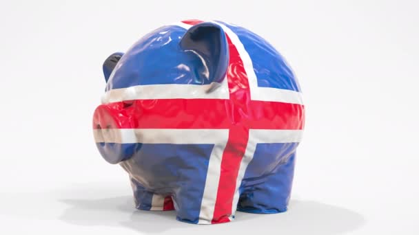 Deflatoire opblaasbare spaarpot met bedrukte vlag van IJsland. IJslandse financiële crisis gerelateerde conceptuele 3D-animatie — Stockvideo