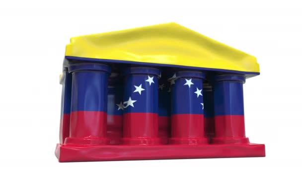 Deflační nafukovací banka nebo vládní budova s tištěnou vlajkou Venezuely. Venezuelská hospodářská nebo politická krize související konceptuální 3D animace — Stock video