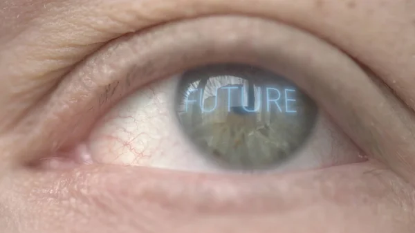 Brilhando FUTURO palavra no olho humano. Fotografia macro relacionada com biotecnologia moderna — Fotografia de Stock