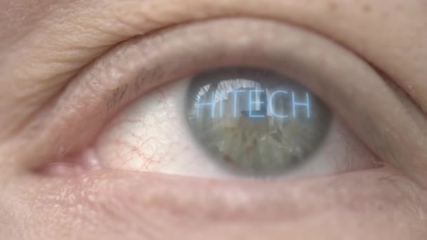 HITECH word on human eye. Modern technology related close-up shot — Stock Video