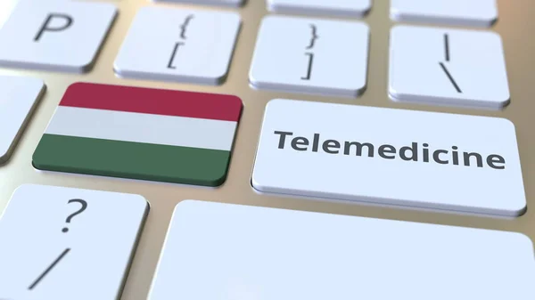 Text telemedicíny a vlajka Maďarska na klávesnici počítače. Vzdálené lékařské služby související konceptuální 3D vykreslování — Stock fotografie