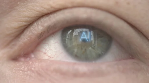 AI or Artificial Intelligence text on human eye. Modern technology related macro shot — Stock Photo, Image