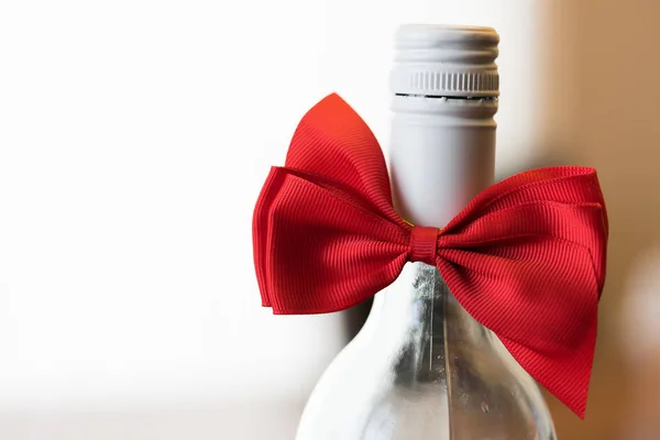 wine bottle with red bow tie - Christmas Present Concept