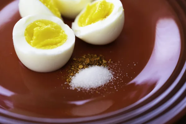 Hard Boiled Eggs sliced in 2 with Pepper and Salt