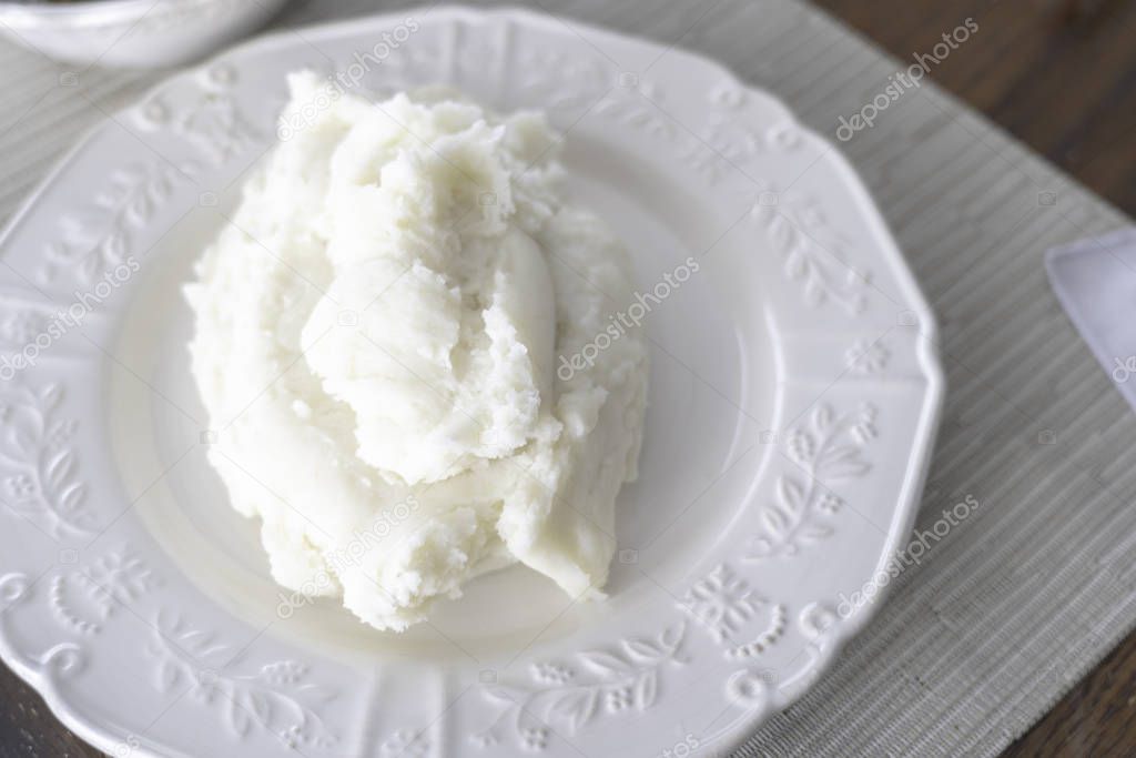 Nigerian Pounded yam on white plate ready to eat