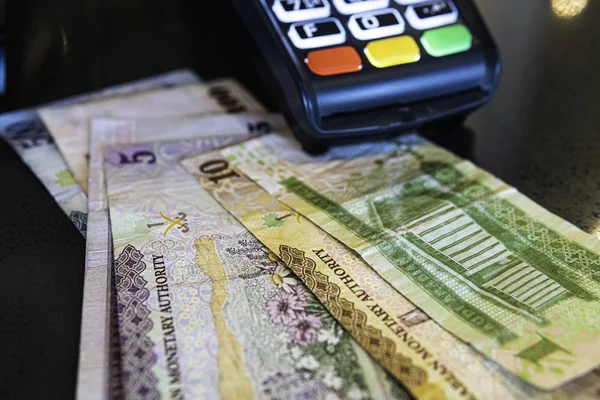 Credit Card Machine with Saudi Riyal Banknotes