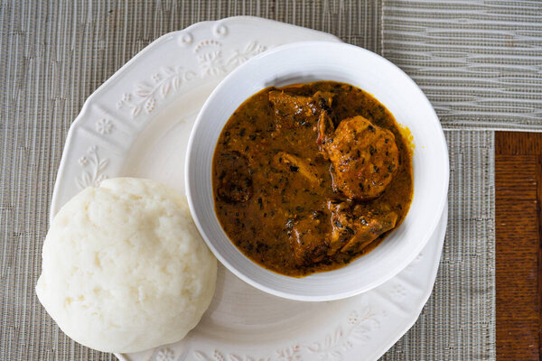 A bowl of Nigerian pounded yam and Ogbono