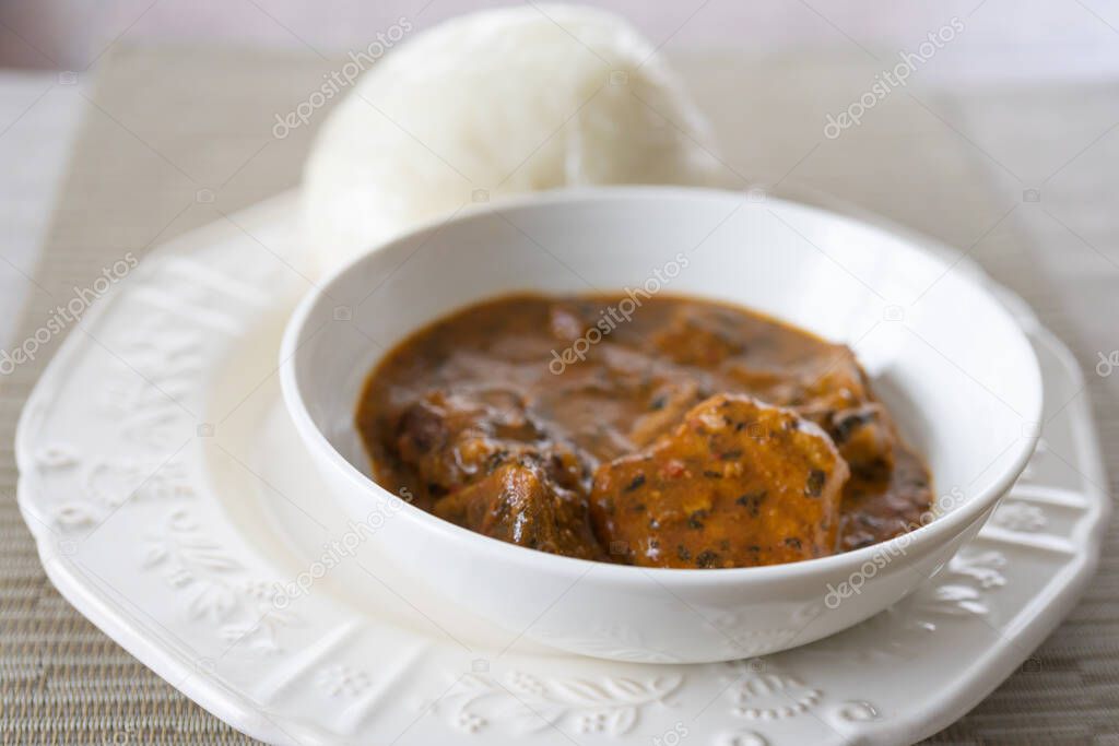 A bowl of Nigerian pounded yam and Ogbono